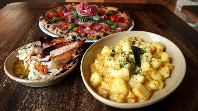 Fare at Gemelli Italian at Broadbeach: Gamberi a Legna, woodfired king prawns with parsley, capers, garlic and chilli — Italia Pizza, mozzarella di bufala, San daniele proscuitto, cherry tomatoes, rocket and sicilian olive oil — Gnocchi con Zucca with pumpkin sage, pine nuts and cream Pic by David Clark