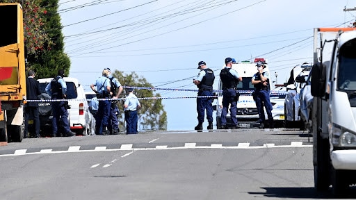 Police seal off streets near today's double murder scene. NCA NewsWire / Jeremy Piper