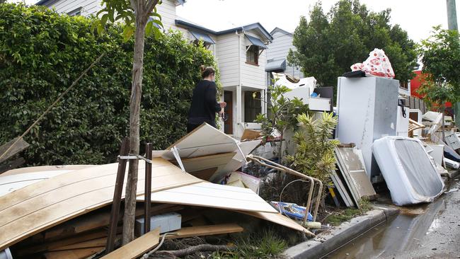 Debris is piled up outside a home in Milton. Picture: Tertius Pickard