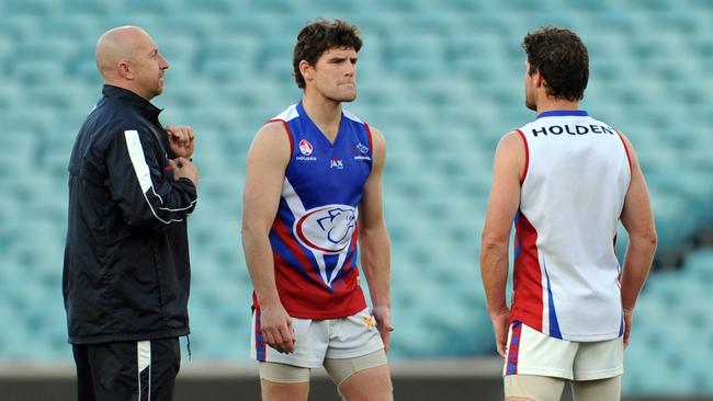 Central District coach Roy Laird talks to Chris (left) and James Gowans during a 2011 training session.