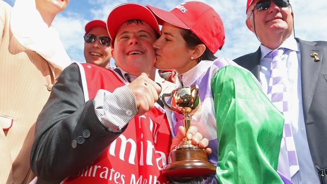 MELBOURNE, AUSTRALIA - NOVEMBER 03: Michelle Payne who rode Prince of Penzance to win race 7, the Emirates melbourne Cup kisses strapper Stephen Payne on Melbourne Cup Day at Flemington Racecourse on November 3, 2015 in Melbourne, Australia. (Photo by Quinn Rooney/Getty Images)