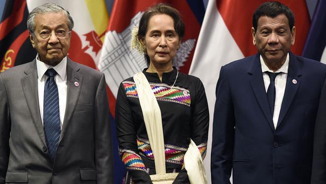 Malaysia's Prime Minister Mahathir Mohamad (L), Myanmar State Counsellor Aung San Suu Kyi and Philippine President Rodrigo Duterte pose for a group photo. Picture: AFP