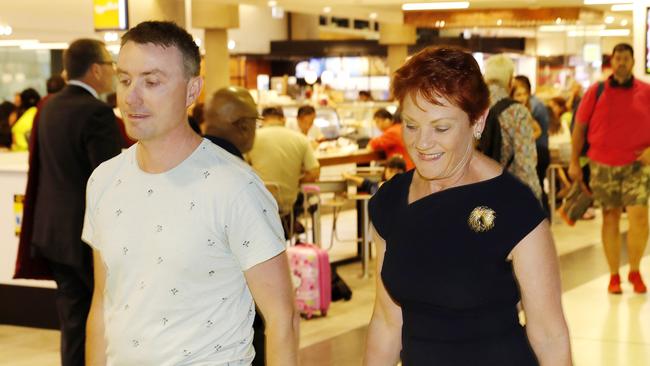 Pauline Hanson and James Ashby arriving from Canberra at the Brisbane Domestic Airport yesterday. Picture: AAP Image/Josh Woning