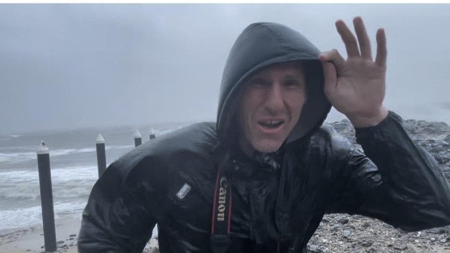 Reporter Peter Carruthers on the fringe of the category 2 storm Cyclone Jasper when it crossed the coast north of Port Douglas in 2023. Wind speeds reached between 154-177 km/h. Picture: Luke Williams