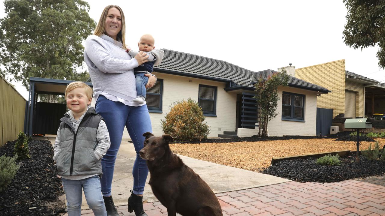 Vendor Eline Gates and her two boys, Oscar, 3, Hugo, 5 months, and dog Django, in front of their home at 29 Auricchio Ave, St Marys. (AAP Image/Dean Martin)