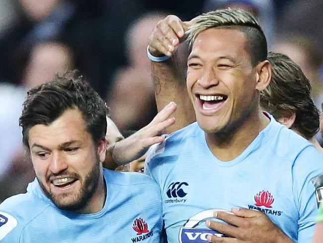 SYDNEY, AUSTRALIA - JULY 06: Israel Folau (C) of the Waratahs celebrates with team mates after scoring a try during the round 18 Super Rugby match between the Waratahs and the Highlanders at Allianz Stadium on July 6, 2014 in Sydney, Australia. (Photo by Matt King/Getty Images)