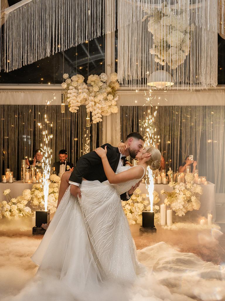 Pyrotechnics and a smoke machine elevated the couple’s first dance. Picture: B Captured by Ky Luu