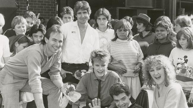 Mark Pedler in white shirt in centre with fellow announcers Greg Clark, Di Stapleton and Neighbours stars.