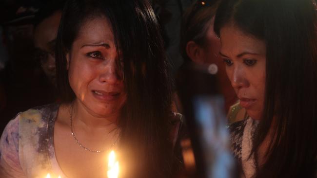 Grief ... Bali Nine duo's supporters prayed in front of Wijaya Pura port as the prisoners were put to death.