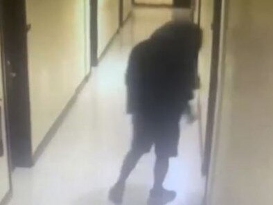 Police are searching for a man captured on CCTV who was seen wearing a black hoodie and hiding his face as he entered a hotel room earlier that morning. Picture: Cavite Provincial Police Office