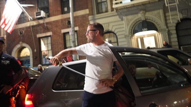 Gavin McInnes, founder of the far-right ‘Proud Boys’ group, brandishes a sword after giving a speech in New York City. Picture: Supplied