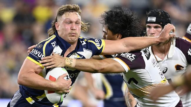 TOWNSVILLE, AUSTRALIA - AUGUST 10: Reuben Cotter of the Cowboys is tackled during the round 23 NRL match between North Queensland Cowboys and Brisbane Broncos at Qld Country Bank Stadium, on August 10, 2024, in Townsville, Australia. (Photo by Ian Hitchcock/Getty Images)