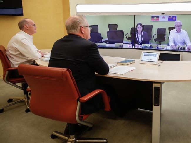 Prime Minister Scott Morrison speaks with NSW Premier Gladys Berejiklian (on screen) during a national cabinet meeting to discuss COVID-19 from the telepresence room of Parliament House in Canberra. Picture: AAP