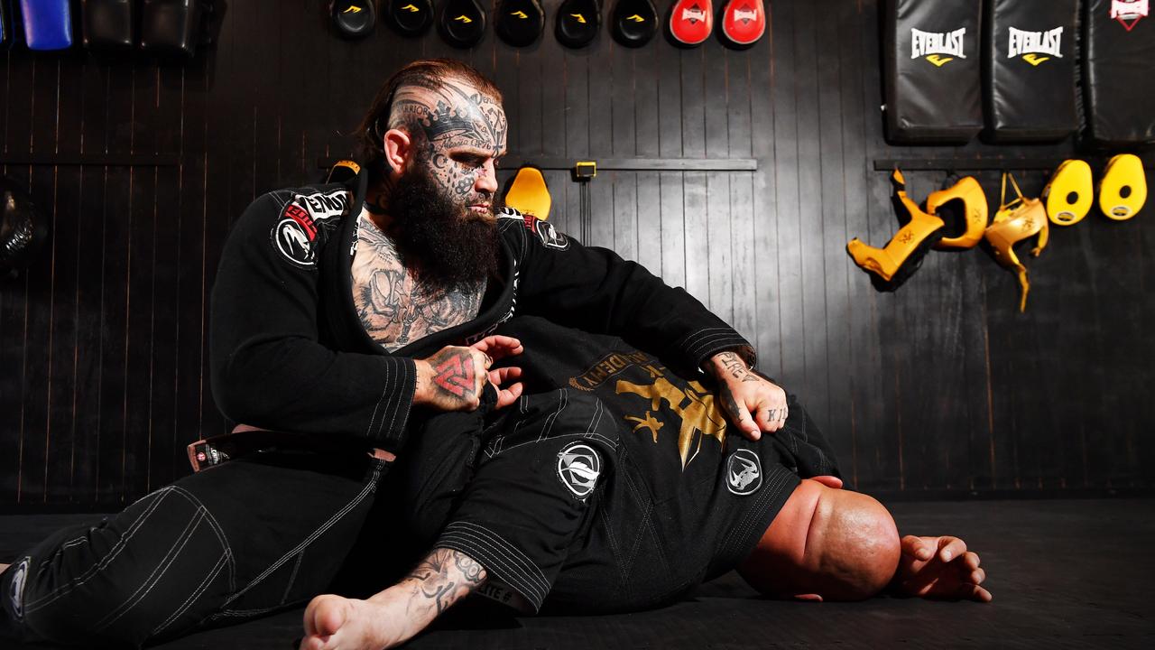 Convicted criminal Nathan Richards pictured with AK Combat team captain Khristo Vatselias at Mr Richards’ MMA gym at Caloundra. Picture: Patrick Woods