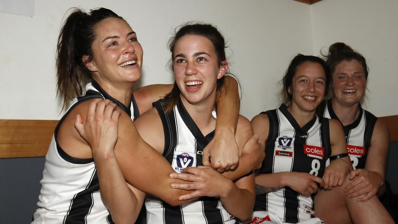 Chloe Molloy (second from the left) is a big fan of the new CBA. Photo: Dylan Burns/AFL Photos via Getty Images
