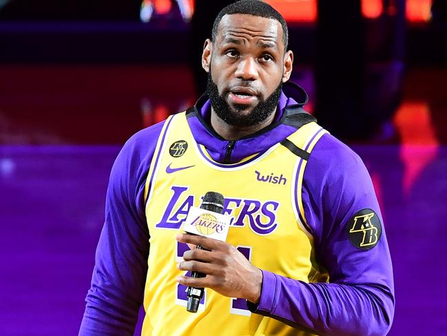 Los Angeles Lakers player LeBron James speaks from center court in honour of NBA legend Kobe Bryant, after he was killed last weekend in a helicopter accident, ahead of a game between Los Angeles Lakers and Portland Trail Blazers, at the Staples Center in Los Angeles, California on January 31, 2020. (Photo by Frederic J. BROWN / AFP)