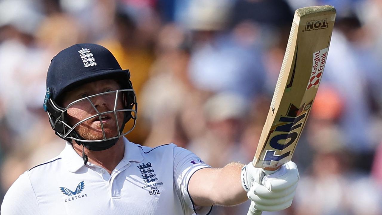 Jonny Bairstow celebrates reaching his half century. (Photo by Adrian DENNIS / AFP)