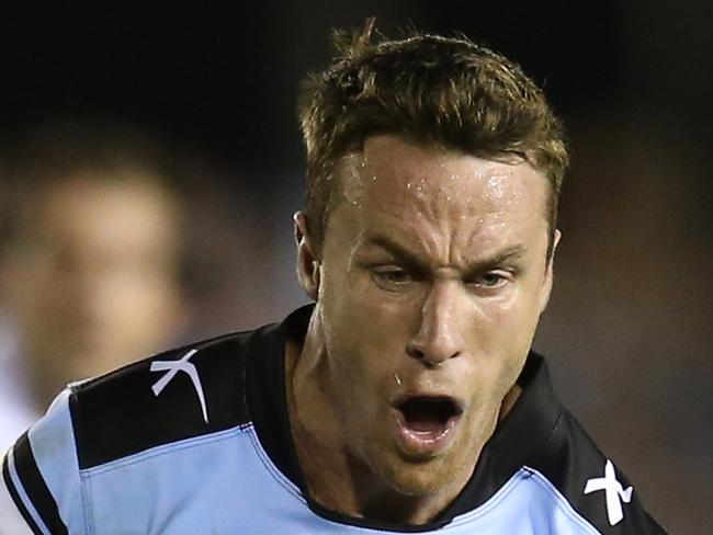 James Maloney of the Sharks tackled by Felise Kaufusi of the Storm during the round 4 NRL match between Cronulla Sutherland Sharks and Melbourne Storm at Shark Park, Cronulla, Monday, March 28, 2016. (AAP Image/Craig Golding) NO ARCHIVING, EDITORIAL USE ONLY
