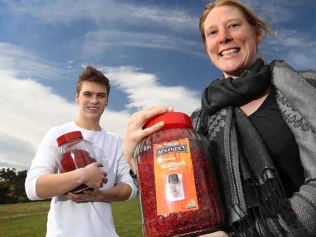 Patrick Noonan 20 of Glaziers Bay, left, and Sally Brown 33 of Cygnet with a big jar of Tas-Saff saffron. pic Sam Rosewarne