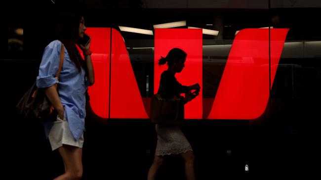 SYDNEY, AUSTRALIA - MARCH 27: Pedestrians walk past Westpac Banking Corp. logo at Westpac Place building on March 27, 2024 in Sydney, Australia. In the last quarter, Westpac Bank reported a quarterly cash profit of A$1.8 billion, meeting consensus expectations, while NAB experienced a 17% decline in first-quarter cash profit compared to the previous corresponding period, reflecting varying performances among the major Australian banks. (Photo by Brendon Thorne/Getty Images) (Photo by Brendon Thorne/Getty Images)