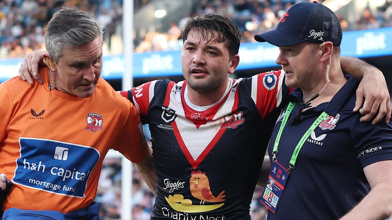 SYDNEY, AUSTRALIA - SEPTEMBER 01: Brandon Smith of the Roosters is helped off the field with an injury during the round 26 NRL match between Sydney Roosters and Canberra Raiders at Allianz Stadium, on September 01, 2024, in Sydney, Australia. (Photo by Cameron Spencer/Getty Images)