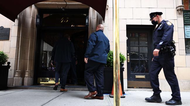 Police enter the Manhattan apartment complex where Rudy Giuliani lived last week. Picture: Getty Images