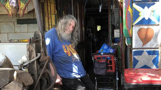 Royce Wells, 75, outside his distinctive Eastwood house.