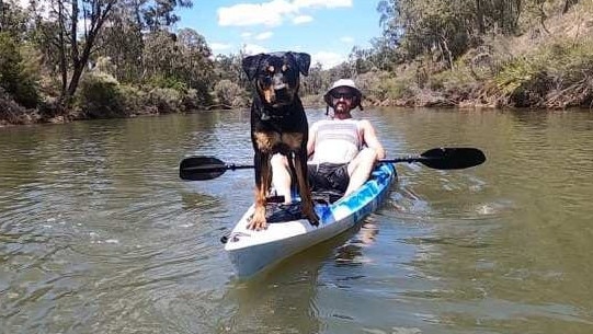 Alister MacPhee and his dog before were attacked by a big croc on the Bloomfield River on Wednesday, February 22. Picture: Facebook