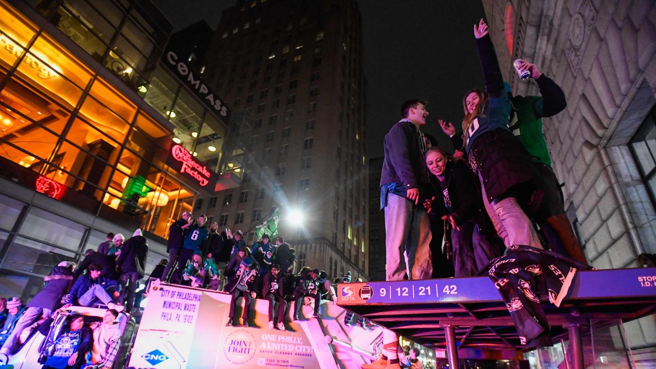 Anything from trucks, cars to bus stops was used by fans to climb all over and get above the chaos. Matthew Hatcher/Getty Images/AFP