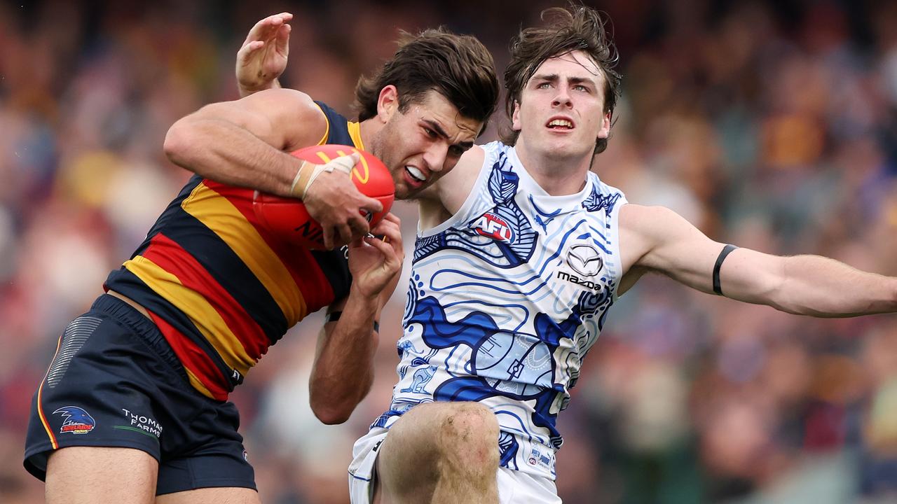 Josh Rachele of the Crows marks the ball in front of George Wardlaw of the Kangaroos during the 2023 AFL Round 16 match at Adelaide Oval. Picture: Sarah Reed