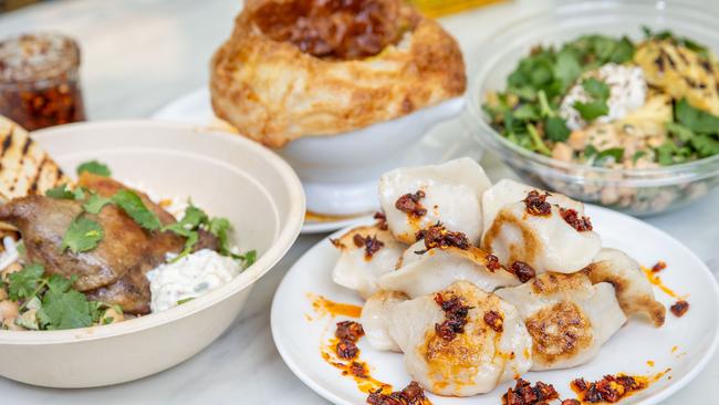 MELBOURNE, AUSTRALIA - DECEMBER 9 2024*HOLD FOR KITCHEN DONFIDENTIAL*Duck Biriyani Bowl, Pork and cabbage dumplings, Chicken Pot Pie and Halloumi bowl from Silkspoon restaurant in MelbournePicture: Brendan Beckett