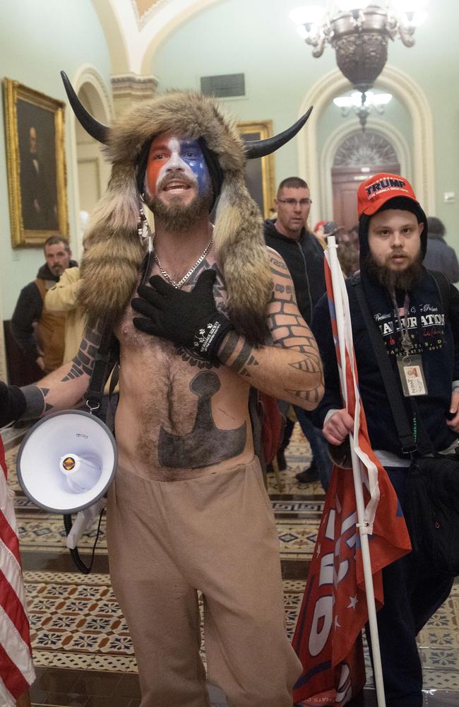 He is also known as the QAnon Shaman and Yellowstone Wolf. Picture: Win McNamee/Getty Images/AFP