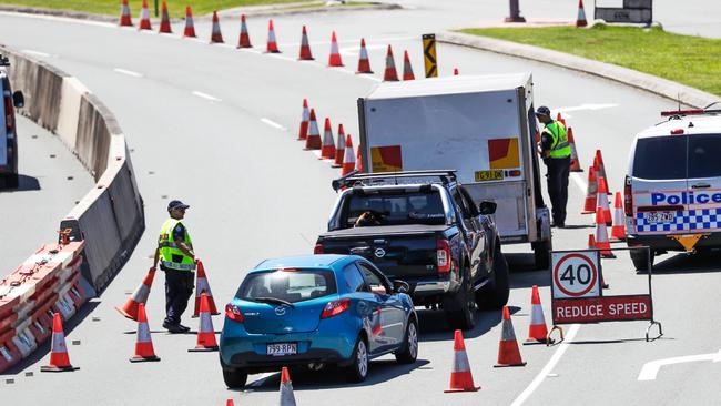 Police at the Queensland border on the Gold Coast Highway. Picture: Nigel Hallett