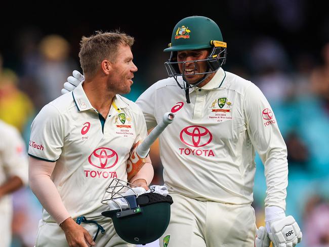 SYDNEY, AUSTRALIA - JANUARY 03: David Warner of Australia (L) and Usman Khawaja of Australia leave the field after day one of the Men's Third Test Match in the series between Australia and Pakistan at Sydney Cricket Ground on January 03, 2024 in Sydney, Australia. (Photo by Mark Evans/Getty Images)