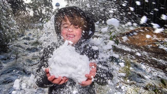 Finn Bamford has some fun in the snow.