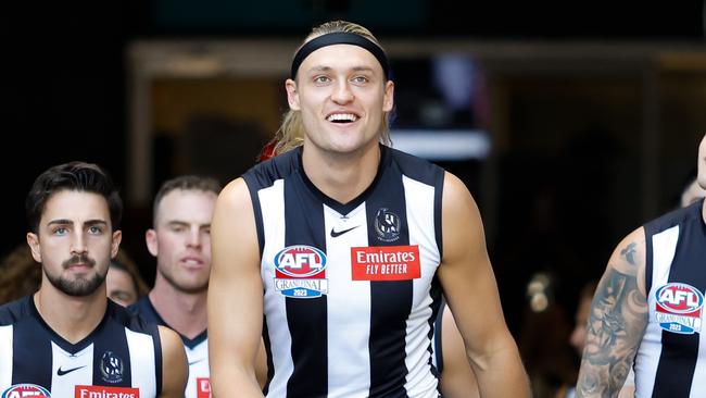 Darcy Moore leads the Magpies onto the MCG in the AFL Grand Final. Photo by Dylan Burns/AFL Photos via Getty Images