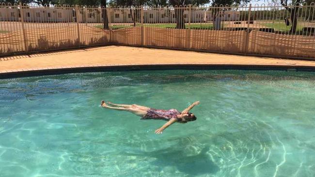 Trish Allen cools off in the swimming pool at the Marla Travellers’ Rest in the state's Far North.