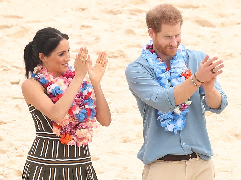Prince Harry and Meghan Markle visit Bondi Beach to meet a local surfing community group raising awareness for mental health and wellbeing known as OneWave. Picture: Brett Costello