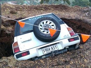 Sink hole swallows car whole