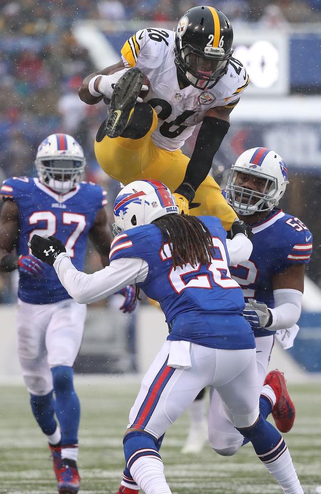 Le'Veon Bell #26 of the Pittsburgh Steelers jumps over Ronald Darby #28 of the Buffalo Bills.