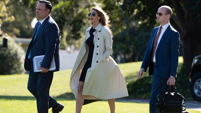 Dan Scavino (L), Director of White House Social Media, Hope Hicks, White House counsellor, and Stephen Miller (R), White House senior advisor, walk to Marine One. Picture: AFP.