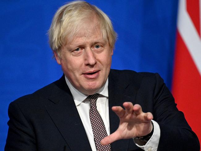 Britain's Prime Minister Boris Johnson speaks during a media briefing on the latest Covid-19 update in the Downing Street briefing room, central London on November 15, 2021. - Britain's booster programme for Covid-19 vaccinations is to be expanded to younger people after scientists gave the green light on Monday. The UK government's Joint Committee on Vaccination and Immunisation (JCVI) said all healthy adults aged 40-49 should be offered a booster, six months after their second dose. (Photo by Leon Neal / various sources / AFP)