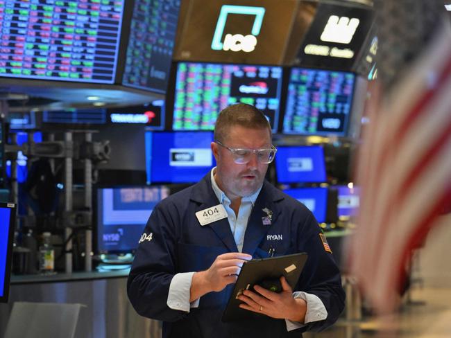 A trader works on the floor of the New York Stock Exchange (NYSE) during morning trading on March 4, 2024 in New York City. Wall Street stocks dipped in early trading Monday at the start of a heavy week of economic news that includes congressional testimony from Federal Reserve Chair Jerome Powell. (Photo by ANGELA WEISS / AFP)