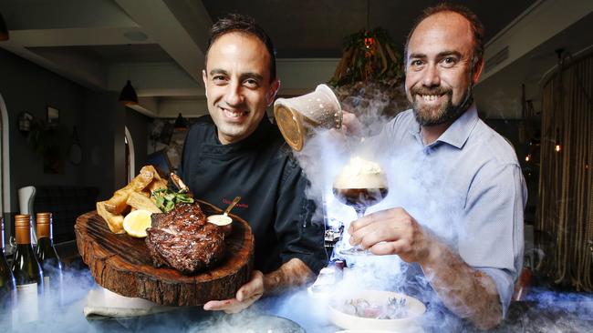 Chris Bonello with a signature Tomahawk steak, and Marcus Fabian with a liquid nitrogen-powered espresso martini. Picture: David Caird