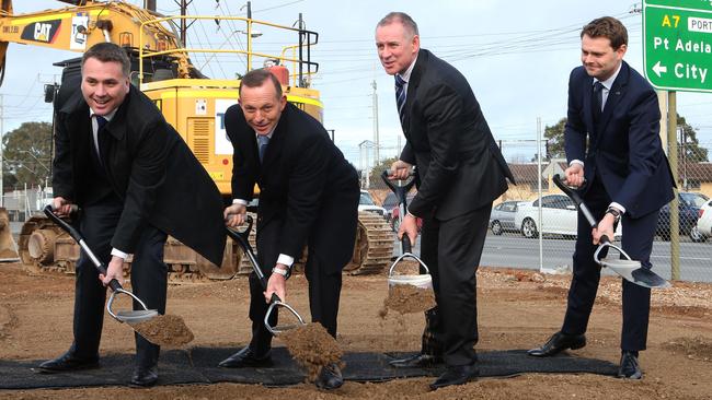 Jamie Briggs, Tony Abbott, Jay Weatherill and Stephen Mulligan turn sod at the Port Rd and South Rd intersection. Picture: Dean Martin