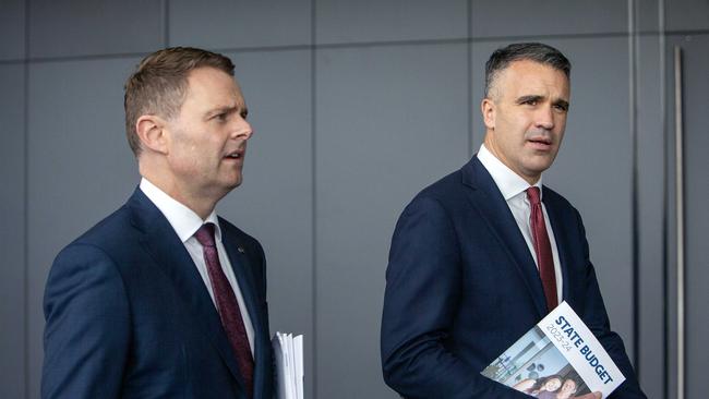 ADELAIDE, AUSTRALIA - NewsWire Photos - JUNE 15, 2023: South Australian Premier Peter Malinauskas and Treasurer Stephen Mullighan with the budget paper outside SA Parliment House and walking to the Convention Centre on North Terrace. Picture: NCA NewsWire / Emma Brasier.