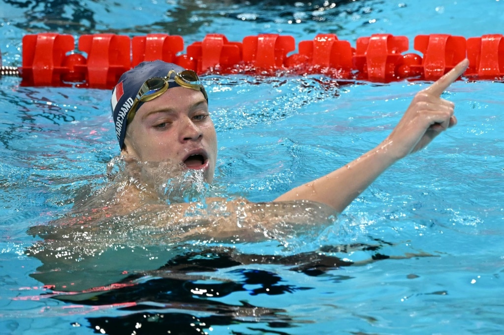 France's Leon Marchand celebrates after winning the final of the men's 400m individual medley at the Paris Olympics