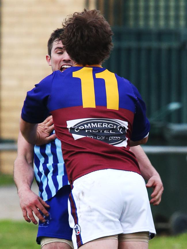 South Morang’s Daniel Healey pushes Reservoir’s Jake McSwain. Picture: Mark Wilson.