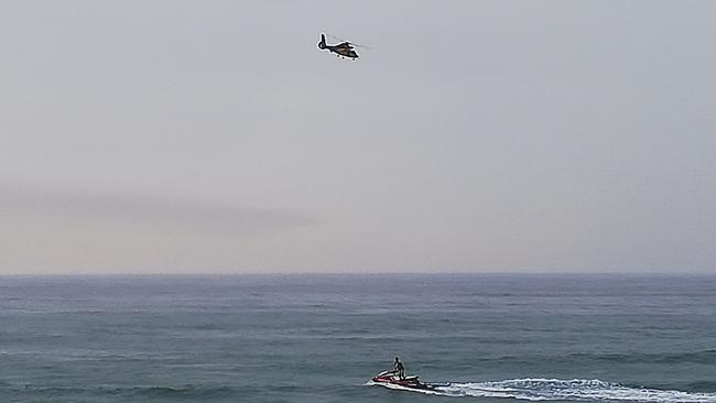 Life guards are assisted by a chopper to look for the sharks. Picture: Supplied