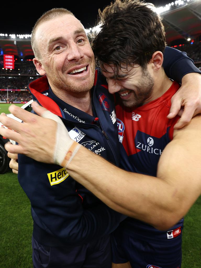 Simon Goodwin hugs Norm Smith medal winner Christian Petracca after siren. Picture: Michael Klein